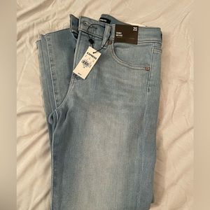 Express Mid Rise Light Wash Ripped Raw Hem Skinny Jeans